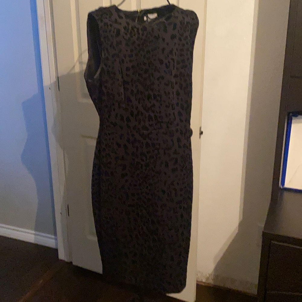 Anne Klein black animal print with gold zipper in back.